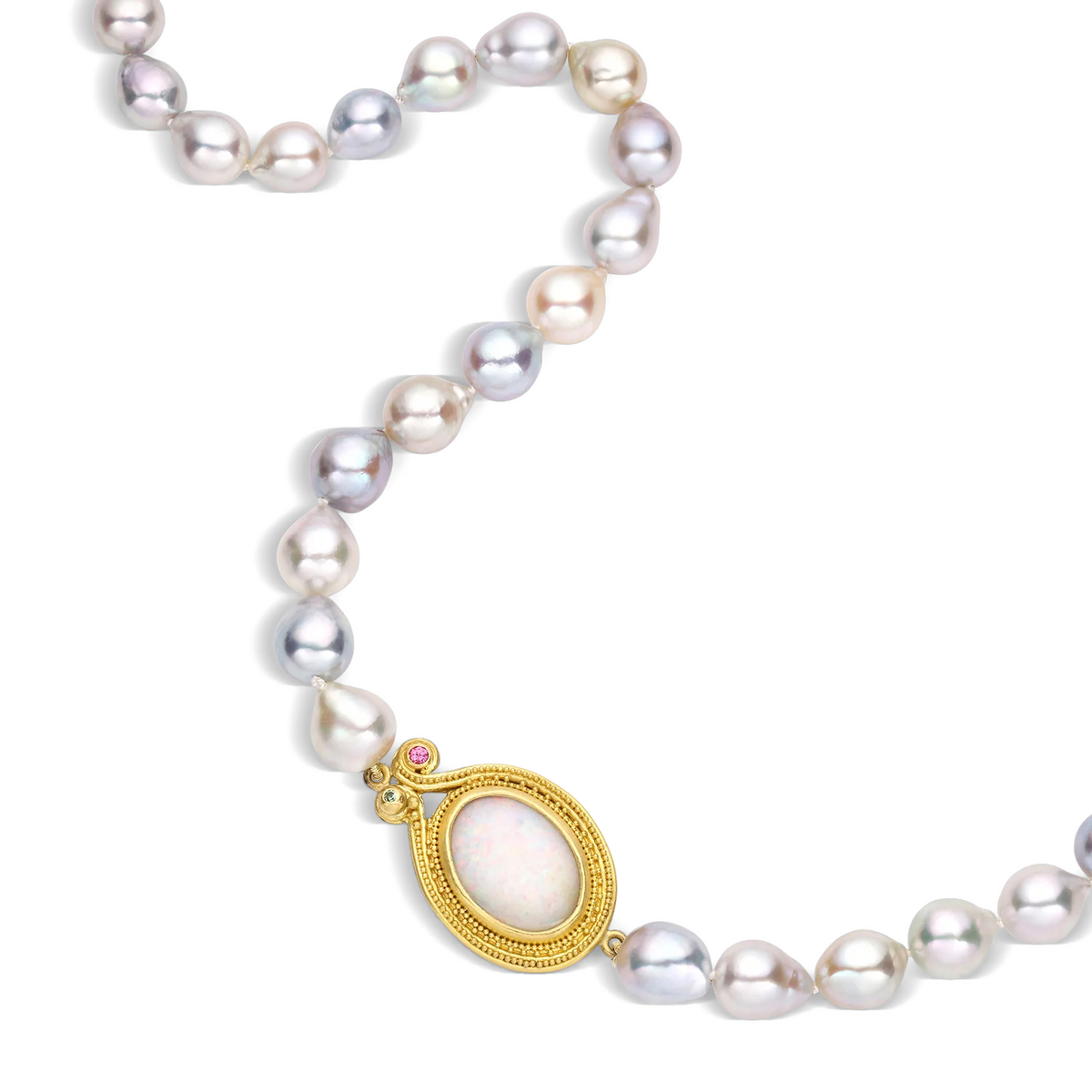 Luminous semi-baroque Akoya pearls in colors of cream, gold, green, silver and blue combine in this glowing pearl strand with an opal station. The oval shaped white Australian opal (2.6ct) has flashes of orange, green and blue, complementing the rich, warm, buttery tones of the gold, enhanced with granulation, pink spinel (.04ct) and tsavorite garnet (.04ct). Length 21.5 inches. Made with recycled 22k yellow gold and cultured 6.5-8.5mm Japanese Akoya pearls and responsibly sourced gemstones. Knotted on silk