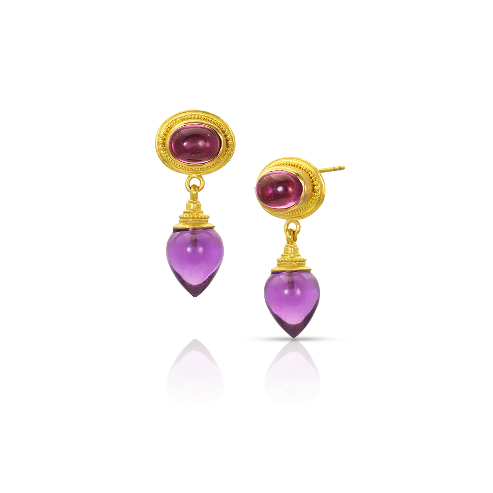The amphora is named after an ancient Roman or Greek storage jar. This amphora has intense rich, deep pink rubellite tourmalines and delicate hand carved rich amethyst set in warm, buttery gold. Our signature graduated granulation frames both the tourmaline and the amethyst, providing subtle details and a beautiful blend of ancient and modern. Made from 22k yellow gold, 2.93ct Brazilian pink tourmaline, 11.85ct Brazilian amethyst.

Two-of-two-of-a-kind.