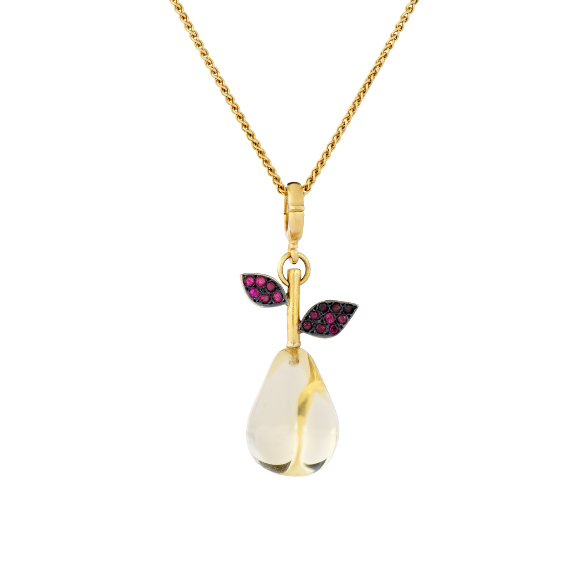 This exquisitely hand carved citrine pear has ruby studded leaves and a ruby topped stalk. Length approx. 40mm, width 16.5 (L 1.6in W .6in).

Made from recycled 22k gold, a carved citrine pear (17.87ctw) and rubies (.32ctw). The chain is available separately.