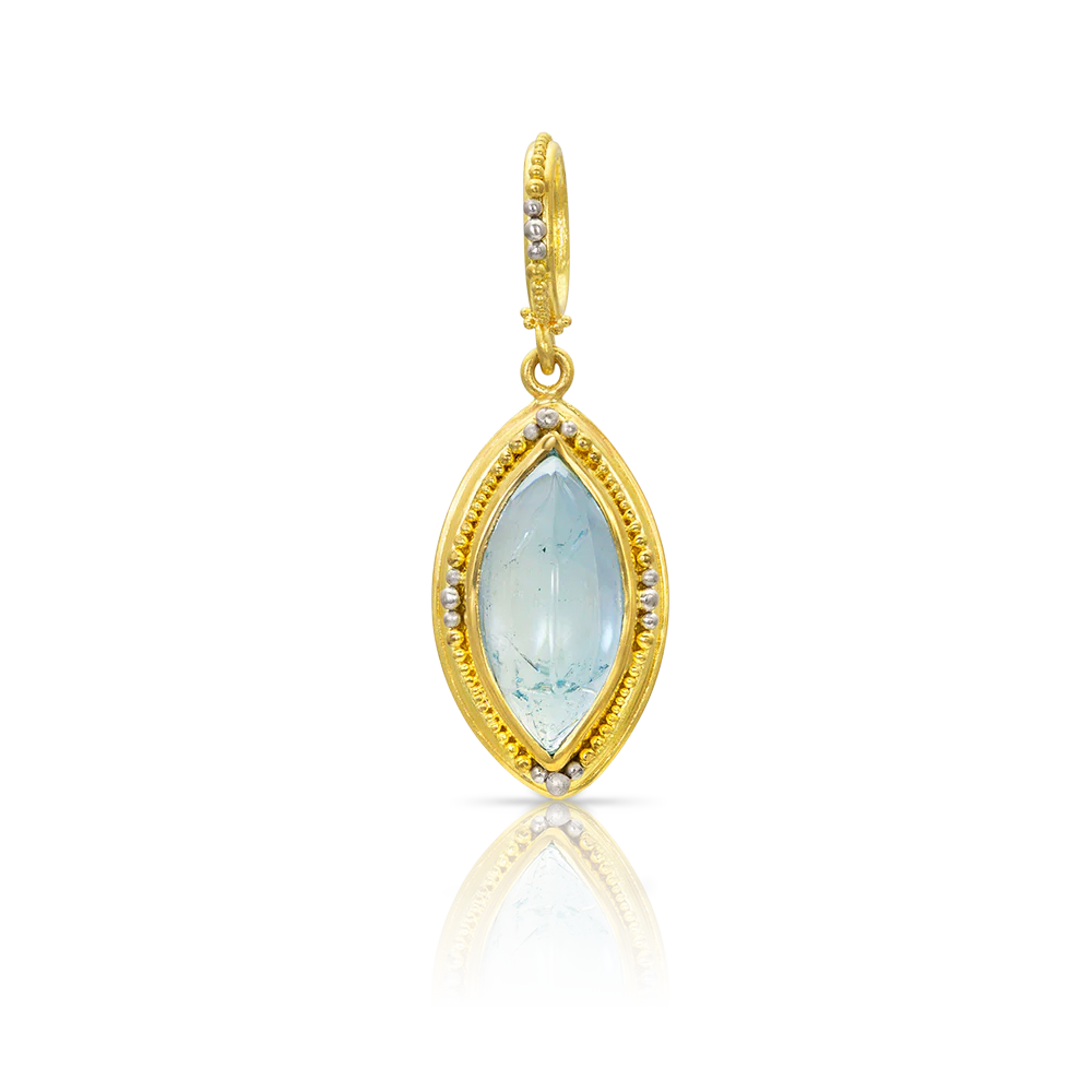 Inspired by both the original Etruscan and Castellani jewels, this marquise shaped aquamarine cabochon is edged with our signature graduated gold and platinum granulation. A similarly granulated bail completes the charm.
Handmade using recycled 22k yellow gold and platinum and a Brazilian aquamarine (4.66ctw). Length approximately 34 mm, width 14mm (L 1.34in W .5in).
