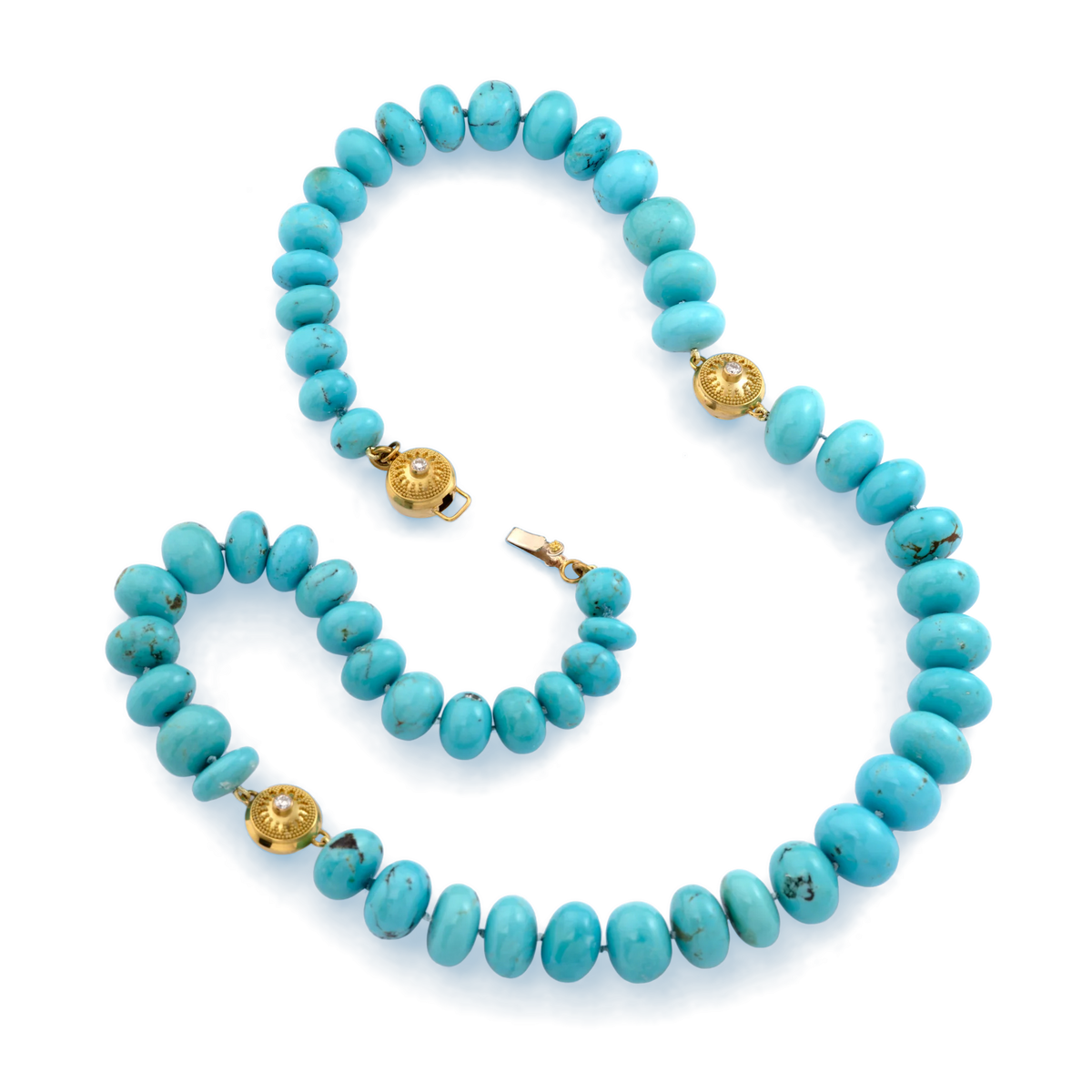 Robin's egg blue is the most sought-after color in turquoise comes and these rondelles come from Arizona's fabled but now closed Sleeping Beauty mine. We balanced the turquoise's intense color and substance with granulated gold stations accented with sparkling diamonds. The handmade clasp is the same station but fashioned as a secure clasp. Length 22.5 inches.

Made with recycled 22k yellow &amp; 18k white gold, Sleeping Beauty turquoise (502ct) and Canadian diamonds (.36ct). Knotted on silk.