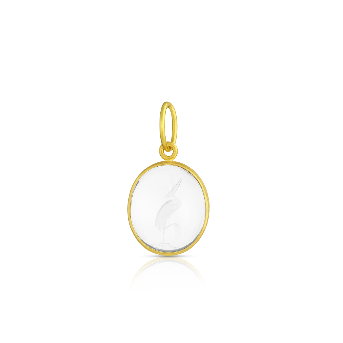 One-of-a-kind hand carved rock crystal charm of a heron delicately balanced on one leg. This carving is based on a carved gem held by the Museum of Fine Arts in Boston from the classical Greek period 450-425 BC, after the manner of Dexamenos of Chios, recognized as one of the great gem carvers of antiquity.  Made in recycled 22k yellow gold and Brazilian Ataléia rock crystal. Length approximately 24mm W 12.8mm (L .9in W .5in). Chain is available separately.