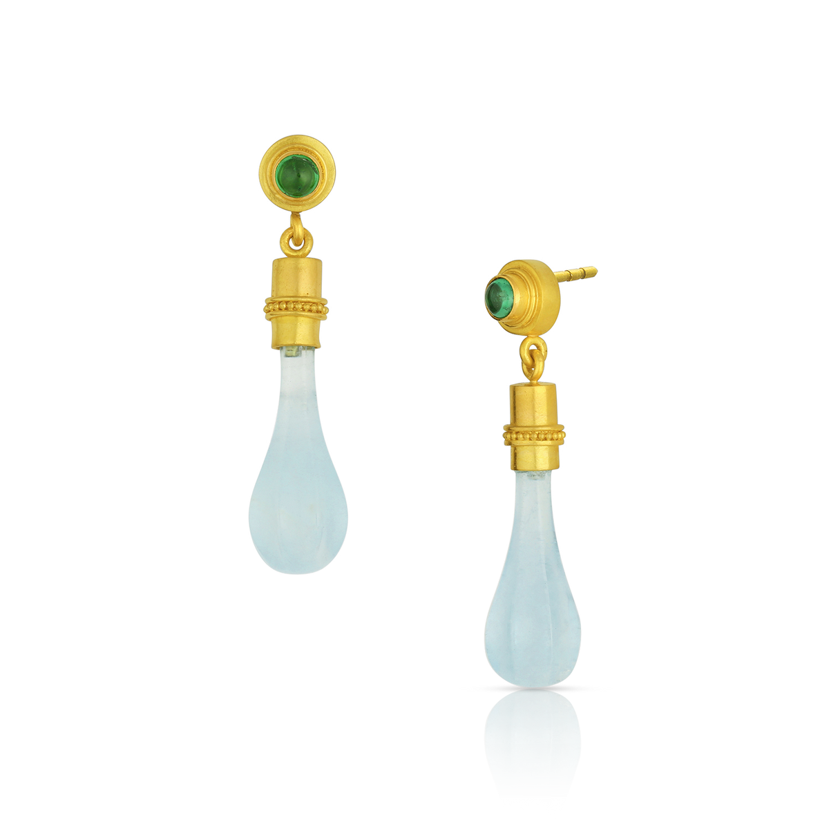 Delicate hand carved natural blue topaz clava, or "club" shaped drops, are a feature of these dainty earrings. Capped with warm gold and velvety granulation, they swing gently from bright green bezel set tsavorite garnets. Post and Guardian back.&nbsp;

Made from recycled 22k gold, hand carved natural blue topaz and Kenyan garnets.