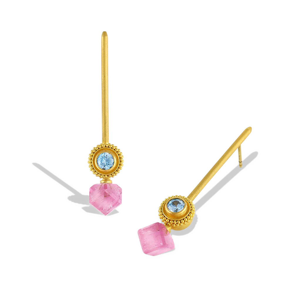 Golden spheres, edged with a ruff of granulation and set with glittering blue zircons, are the perfect foil for bright bi-color pink and white tourmaline cubes, offset for a fresh, modern look. Long, golden wands allow the spheres and cubes to swing gently from the ear. These are a one-of-a-kind piece - no combinations of gemstones are repeated. Length approx. 46.8mm W 9.2mm (L 1.8in W .4in). Made in recycled 22k yellow gold, Brazilian tourmaline (7.46ctw) and Cambodian zircon (1.03ctw).