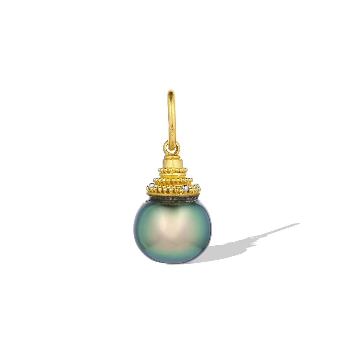 When I saw this pearl, I simply had to have it. It was the embodiment of "small but mighty" and was shaped like a freshly picked blueberry, with an intense metallic blue green luster rarely found. It looks equally stunning in natural or indoor light. Granulation in both gold and platinum gives volume and texture to the temple shaped cap and enhances the beautiful blues in the pearl. Length approx. 21.7mm, width 9.9mm (L .9in W .4in). Made from 22k gold and platinum and a 9.9mm cultured Tahitian pearl.