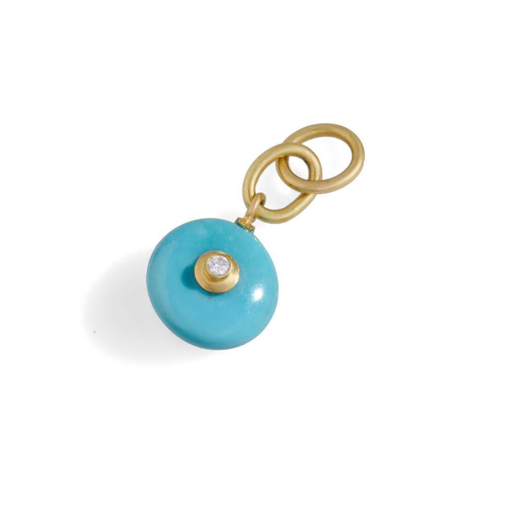 With its lovely robin's egg blue color, this beautiful turquoise from Arizona's famed Sleeping Beauty mine makes a timeless and versatile diamond studded charm. So, bring out a gold chain or silk or leather cord and wear it solo or mix with your favorite charms and pendants. Length approximately 39mm, width 10.7mm (L 1.5in W .4in).

Made from recycled 18k gold, a 12.25mm Sleeping Beauty turquoise rondelle (5.02ctw) and a Canadian diamond (.06ctw). The chain is available separately.