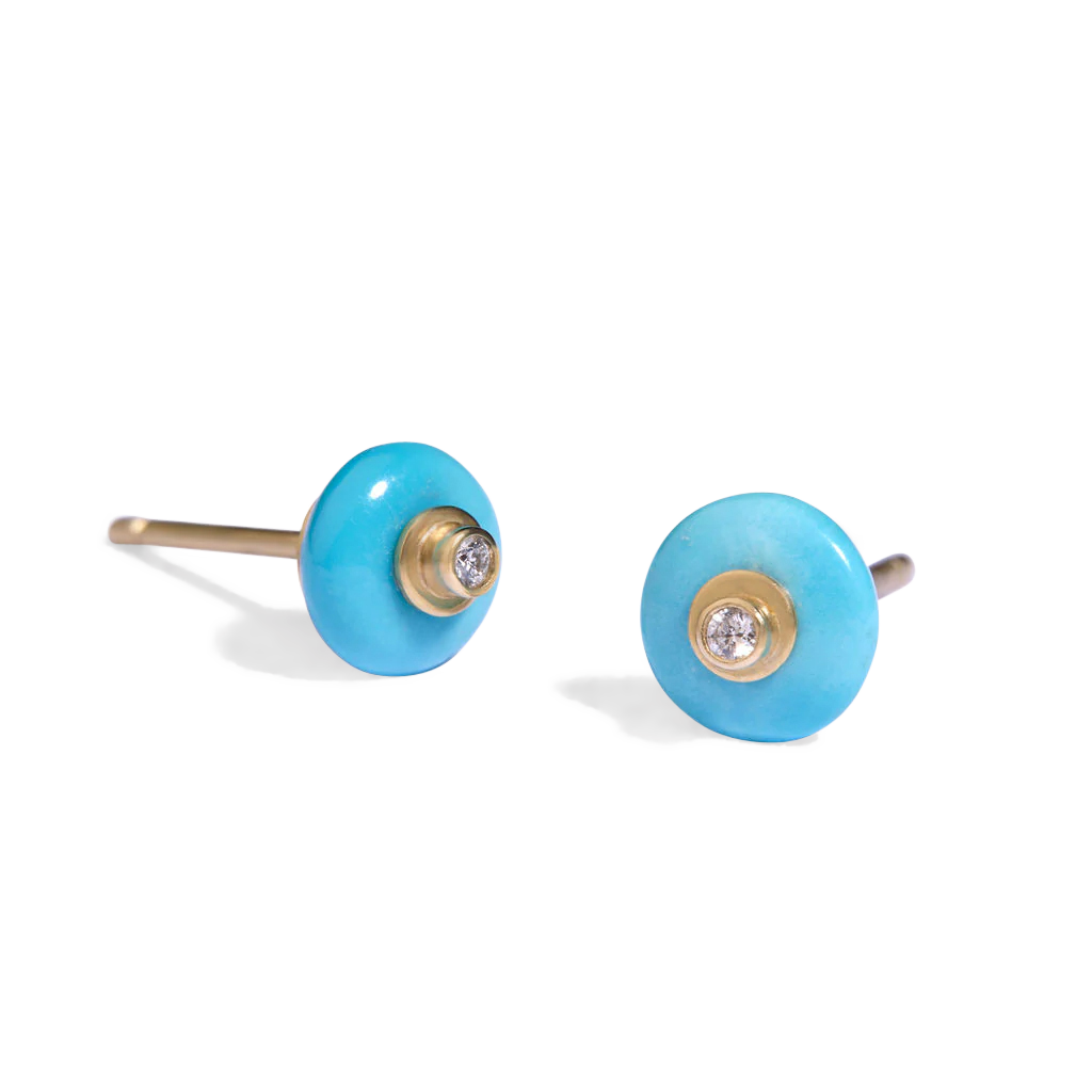The Robin's Egg blue in this beautiful turquoise from Arizona's famed Sleeping Beauty mine makes a timeless and versatile pair of diamond decorated studs. These intense blue rondelles with their discreet diamond sparkle are perfect for everyday wear. Wear with your favorite denim shorts and tee, crisp button down, sweater or dress. Length and width approximately 7mm (L .3in W .3in). Made from recycled 18k gold, 7mm Sleeping Beauty turquoise rondelles (1.77ctw) and Canadian diamonds (VS G .03ctw). 