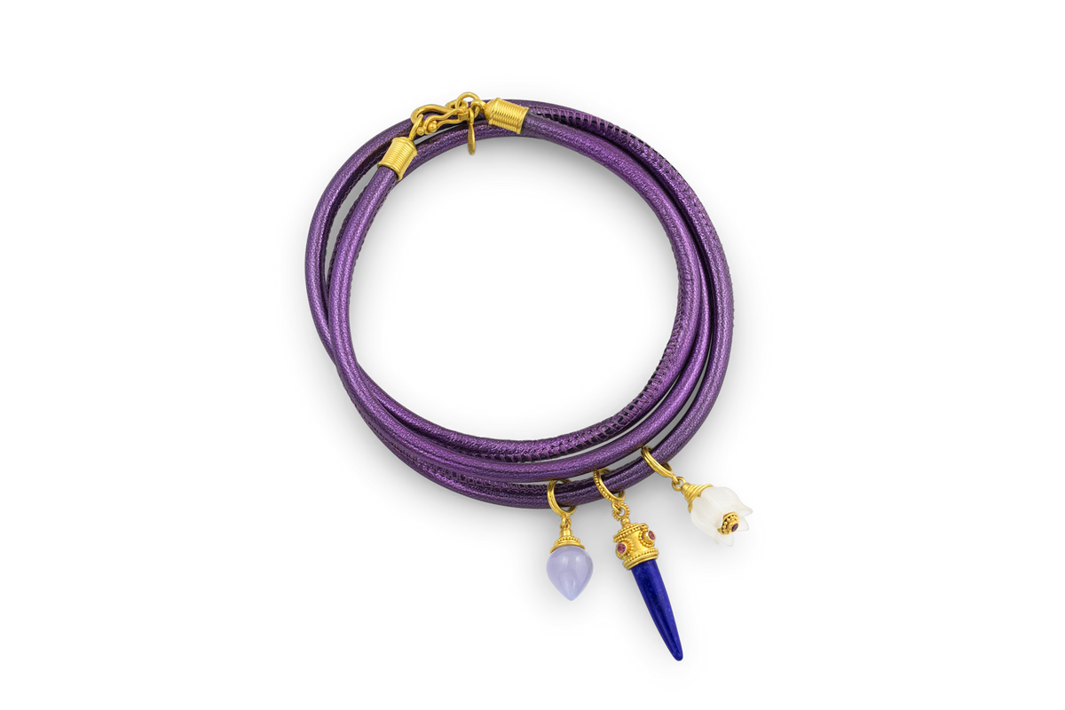 Slide on to our leather wrap, mix and match to create your own story or wear with your favorite chain as a pendant. (Lilac leather wrap and additional charms sold separately.