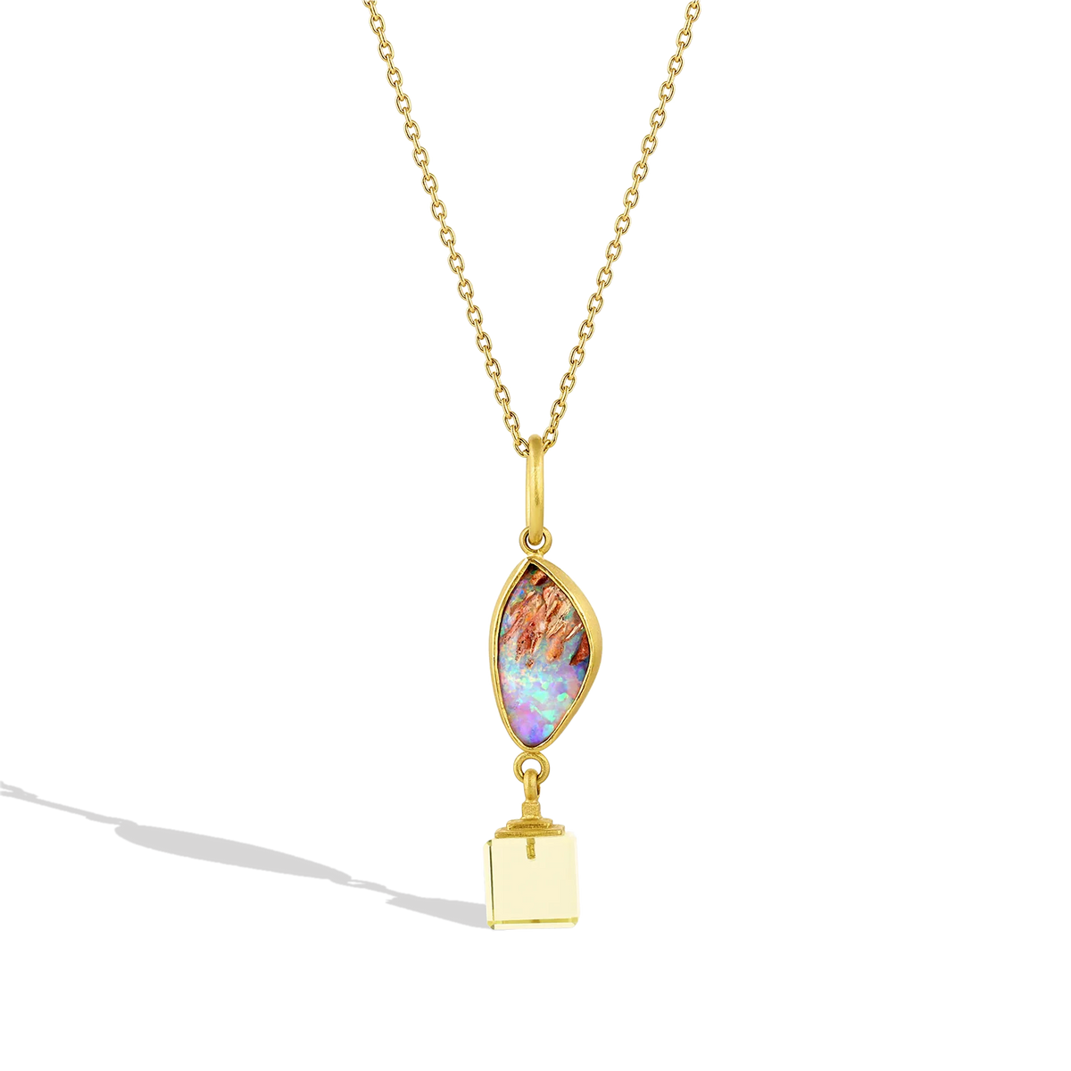 One-of-a-kind charm featuring a beautiful semi-transparent blue/green crystal opal highlighted with a soft lemon quartz cube.  Length approximately 45mm W 10.2mm (L 1.7in W .4in). Measurements refer to charm.

Made from recycled 22k yellow gold, an Australian opal (3.33ctw) and lemon quarts (6.71ctw).