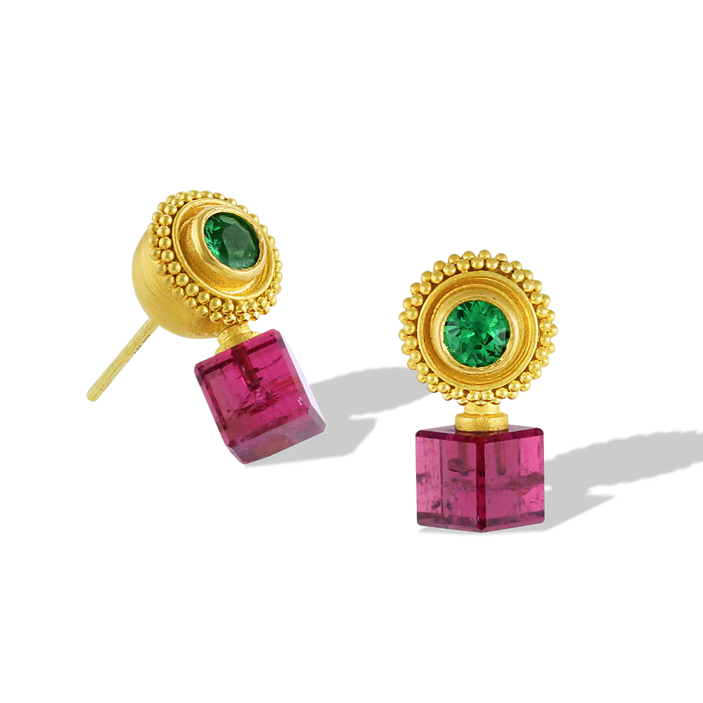 Delicate golden spheres are edged with a soft ruff of granulation and set with selection of vivid gemstones carefully selected to compliment and highlight our custom cut gemstone cubes. The combination of colors brings a Byzantine look to these unusual earrings, bridging the angular contemporary and the ancient. The warm buttery tones of the gold give a patina from antiquity to these unique stud style earrings. Each pair is one-of-a-kind; no combination is repeated. Made in recycled 22k gold and gemstones.