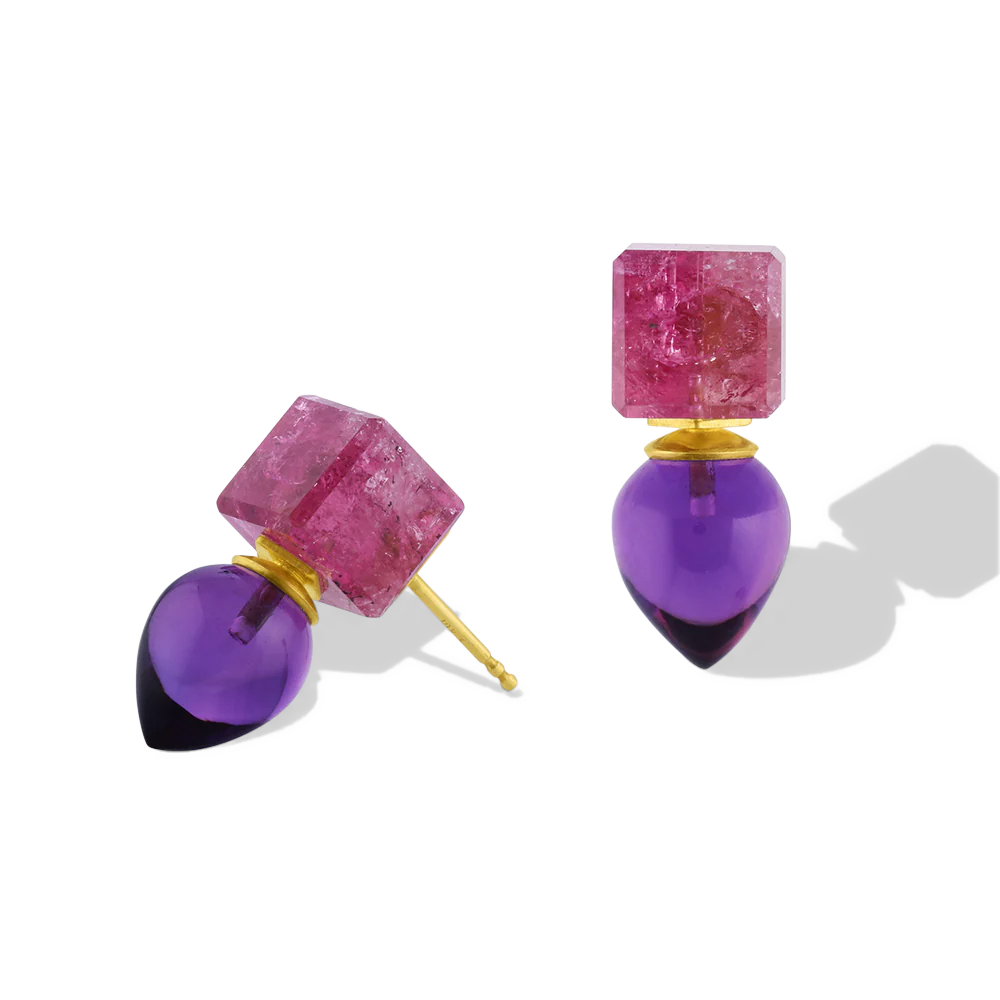 Deep pink custom cut tourmaline cubes provide a striking complement to the royal purple African amethyst drops. These unique drop earrings bridge the geometric modern and the ancient, with the buttery warmth of high karat yellow gold giving a patina from antiquity. Length approximately 21.8mm W 9.2mm (L .8in W .4in).

Made in recycled 22k yellow gold, Brazilian tourmaline (17.97ctw) and African amethyst (11.82ctw).

One-of-a-kind.