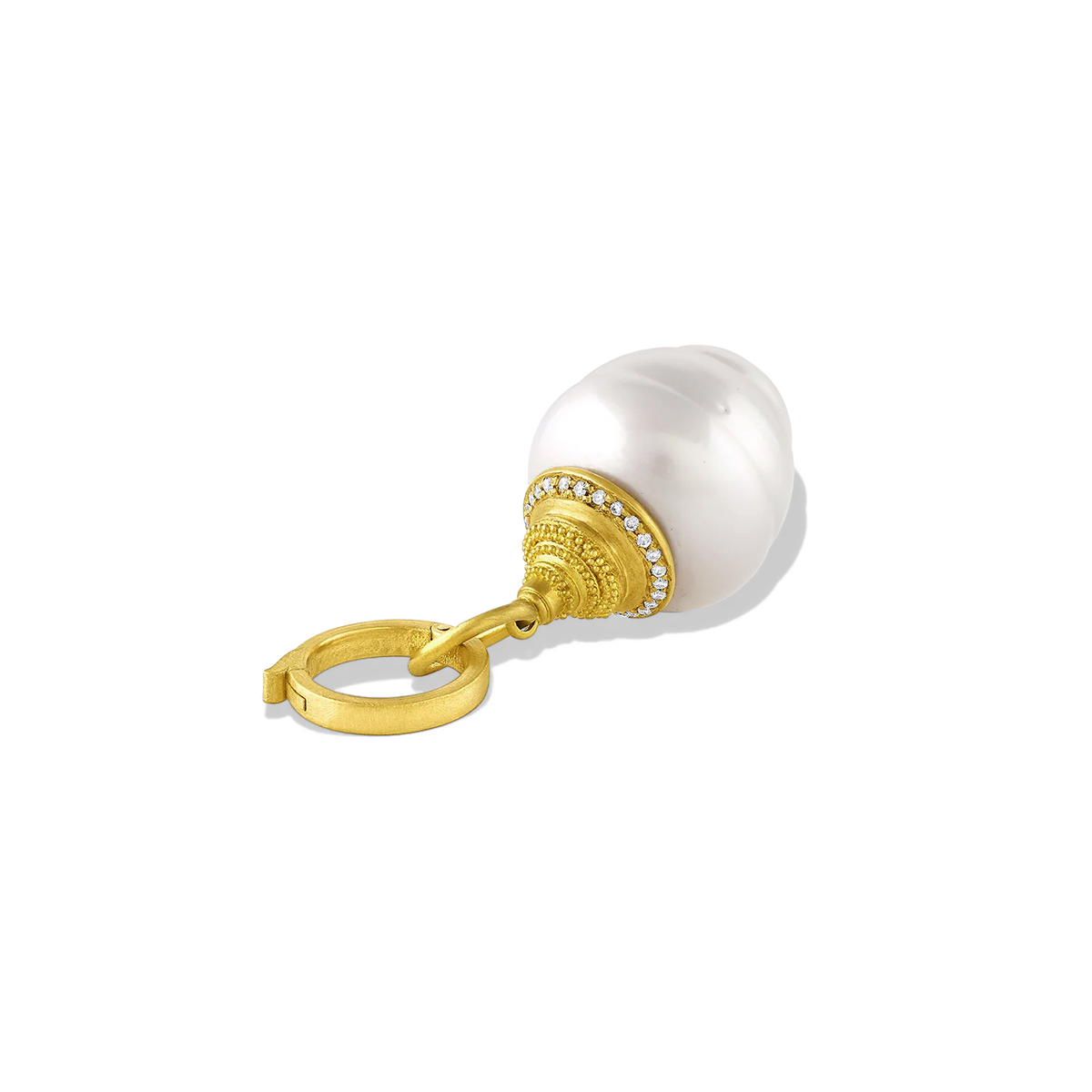 A generously sized lustrous acorn shaped white South Sea Pearl is adorned with sparkling pavé diamonds (.07ct) set in warm, buttery 22k gold. Dainty granulation gives a soft velvety texture that contrasts with the diamond sparkle, while the shape of the cap mirrors the circlé texture of the pearl. Length approx 40mm width 15mm (L 1.5in W .6in). Made from recycled 20k and 22k gold, diamonds (.07ctw) and a 15mm Paspaley South Sea pearl.