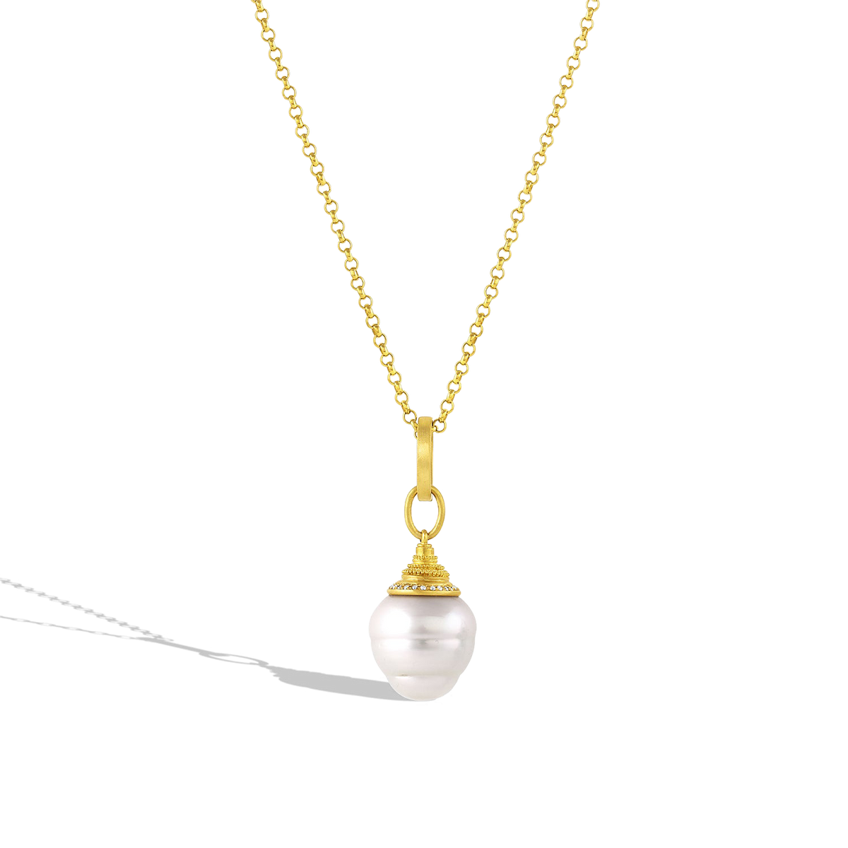 The large Diamond Acorn pearl charm shown on a gold chain.