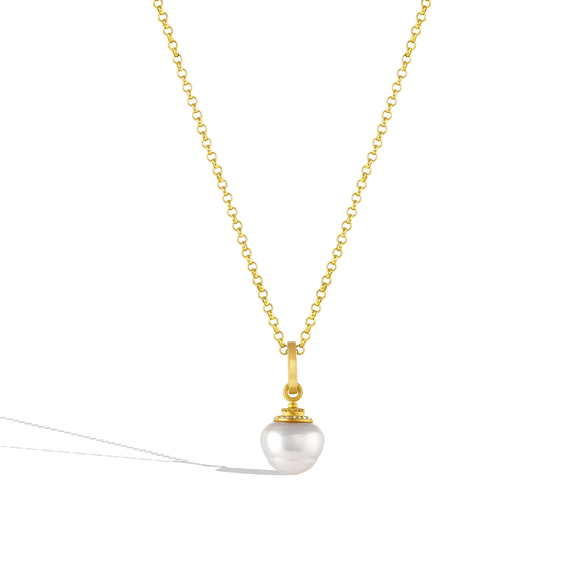 The small Diamond Acorn pearl charm shown on a gold chain. 