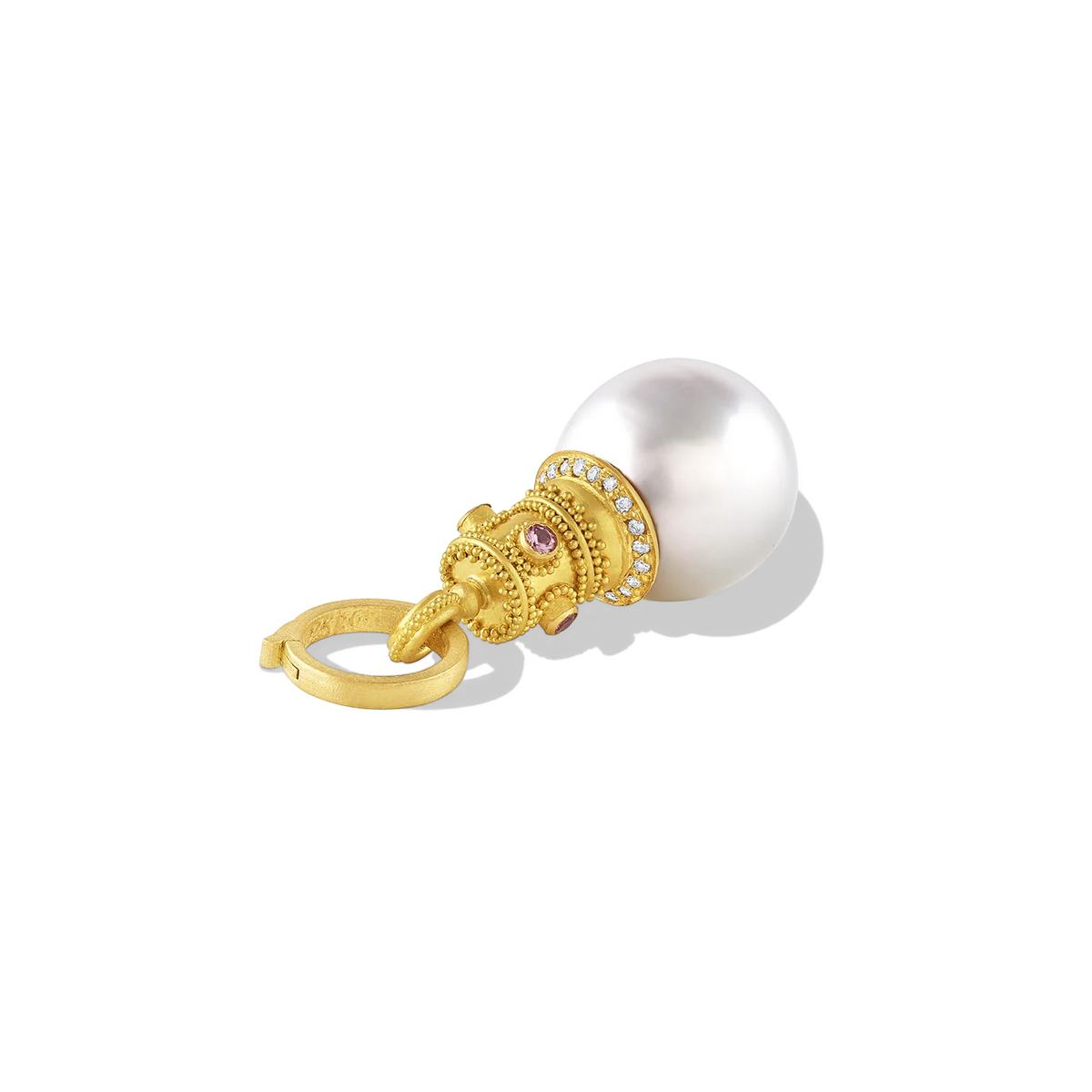 A beautiful, lustrous, egg-shaped, white South Sea Pearl is adorned with the soft mellow, buttery tones of a bejeweled golden granulated crown. Lavender spinels lend a Byzantine air while a discreet diamond sparkle provides a contemporary update. A 20k gold clasp is included. Length approximately 41mm, width 15mm (L 1.6in W .6in).

Made from recycled 22k and 20k gold, diamonds (VS G .1ctw), spinel (.14ctw) and a 15 x 17mm Paspaley South Sea pearl. The chain is available separately.
