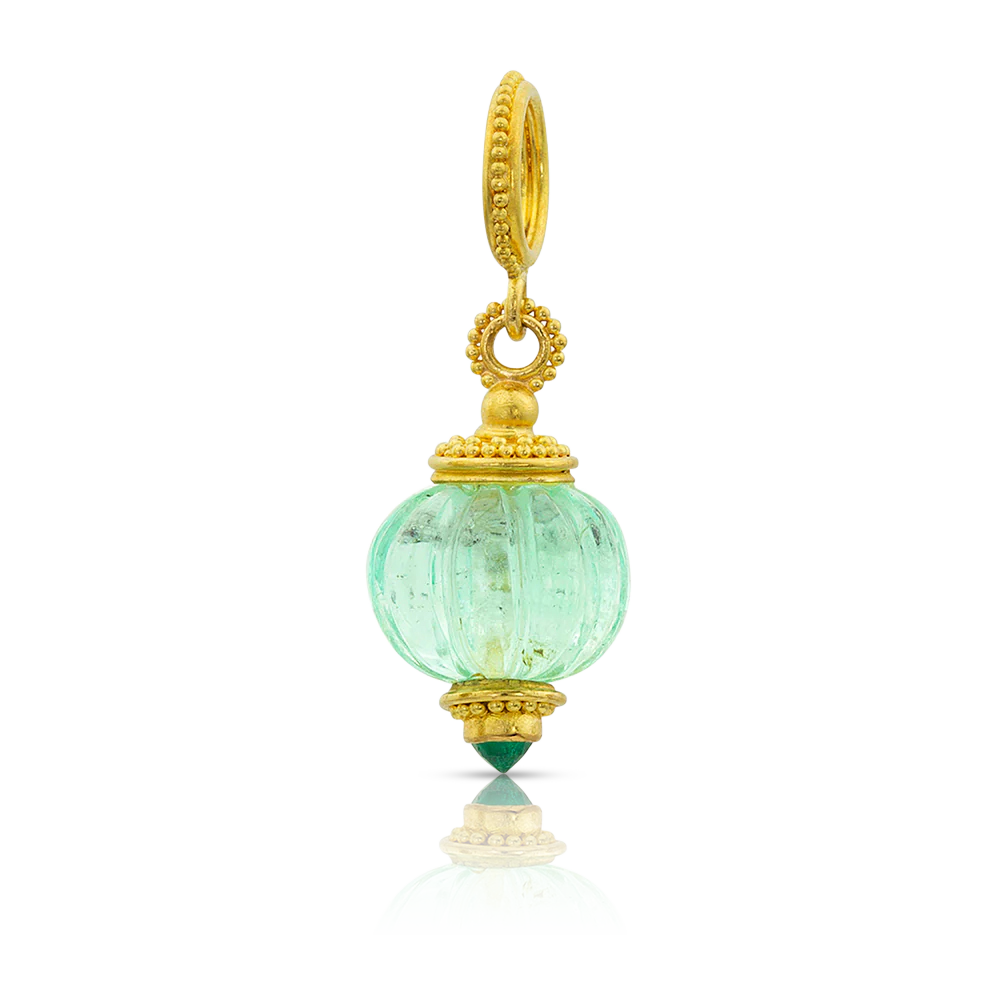 These melon beads are hand carved from selected gemstones and set with delicately granulated caps and bails. The warm buttery tones of the gold gently highlight the melons' "grooves", and at the base of each melon bead, mimicking the blossom end, you will find a tiny, sparkling gem, cradled by granulation that compliments the gemstone it was carved from. Made from 22k yellow gold, 5.83ct Colombian emerald.