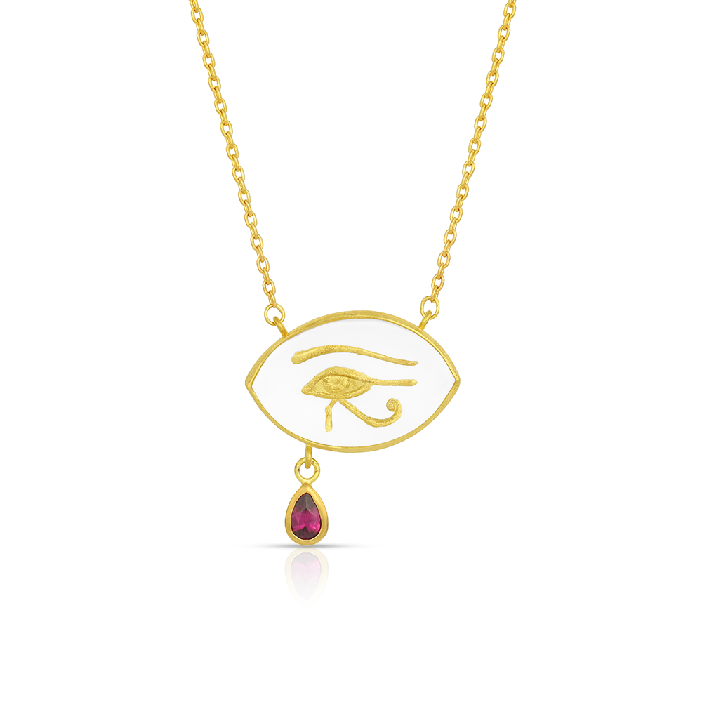 This hand carved and gilded rock crystal pendant depicts the Eye of Horus with a rhodolite garnet tear. The Eye of Horus, also known as wadjet, wedjat, or ujat (meaning 'whole one') is an ancient and enduring Egyptian symbol of protection, royal power, health, healing and restoration.

Handmade in recycled 22k yellow gold, Ataléia rock crystal from Brazil and a Mozambican garnet. The chain is approximately 40.5 cm or 16" long.

Made to order. Please allow 6-8 weeks.
