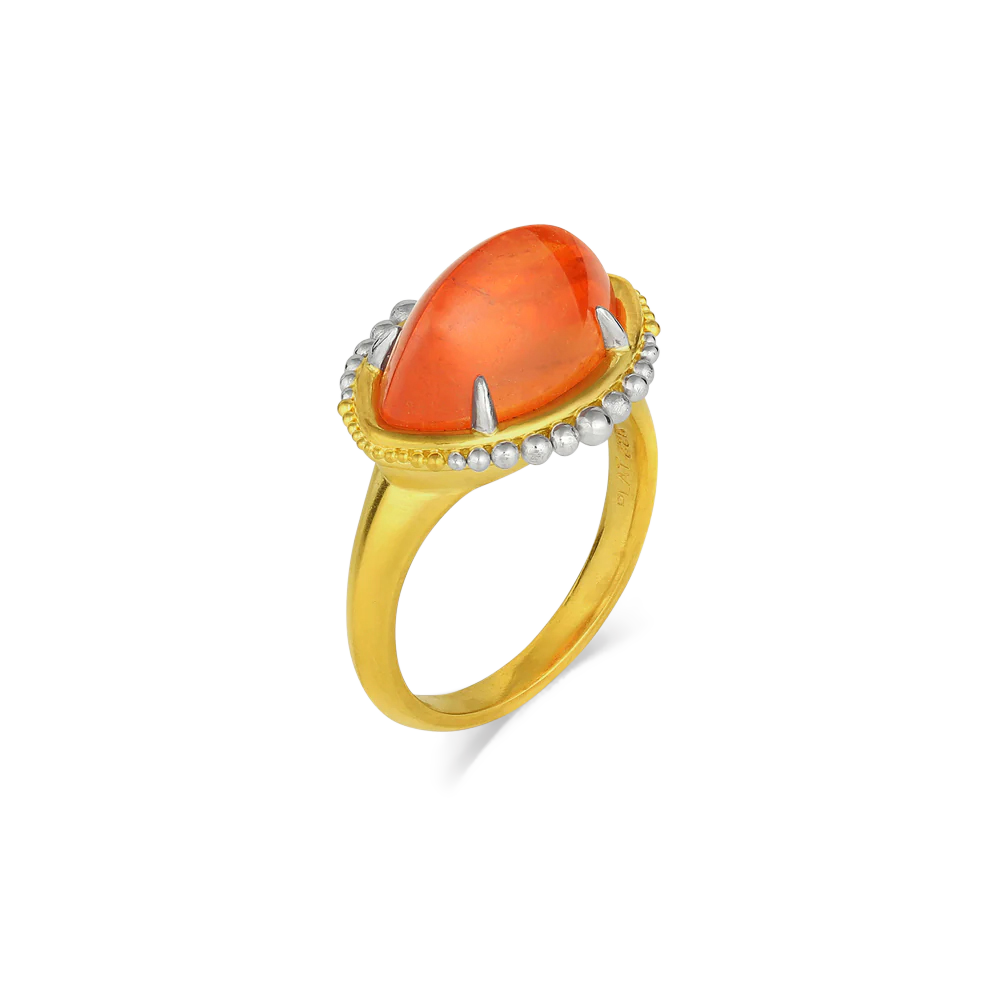 When a stone is special, I'll choose it first and then decide what piece of jewelry I'll create around it This mandarin garnet (9.46ct) is truly special with its fiery orange glow. It really is one-of-a-kind. The fire, the glow, the depth of color - with my signature graduated silvery polished platinum and sift, rich gold granulation floating around it like one of Saturn's rings full of tiny meteors.

Made in recycled 22k yellow gold and platinum and a Tanzanian garnet. Size 7.