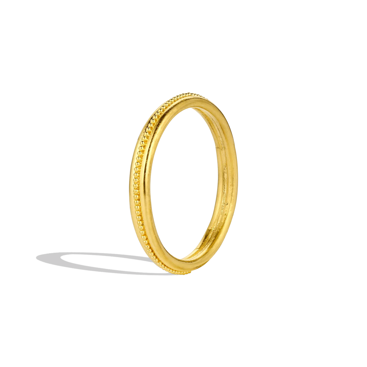 Simple lines (or fila) of gold adorned with delicate hand placed granulation make a subtle yet elegant statement. Although ancient in style, the effect is fresh and modern. Perfect alone or as part of a larger collection.

Made in recycled 22k yellow gold. Size 7. Made to order.