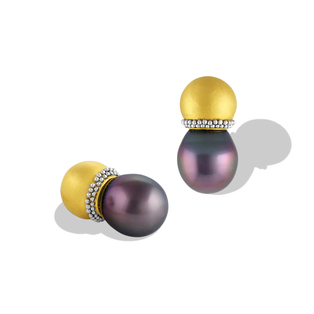 Hollow golden spheres edged with a ruff of platinum granulation hold moody purple toned Tahitian pearls. These uniquely shaped and versatile earrings can be worn as ear climbers or as a stud, simply turn the pearls downwards. Length approximately 22.2mm W 11.9mm (L .8in W .5in).

Made in recycled 22k yellow gold and platinum and 11.9 x 13.6mm Tahitian pearls.

One-of-a-kind.