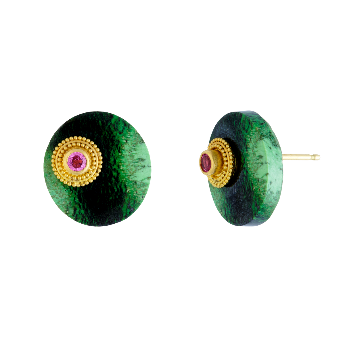 The beautiful vivid green and black roval tablet style cabochons in these stud earrings are grossular garnets from East Africa. Delicately granulated elliptical rondelles cradle hot pink spinel, asymmetrically set on each garnet, providing an unexpected yet harmonious blend of ancient technique and modern design. Made from recycled 18k and 22k yellow gold, grossular garnets (21.4ctw) and Burmese spinel (.34ctw).

One-of-two-of-a-kind.