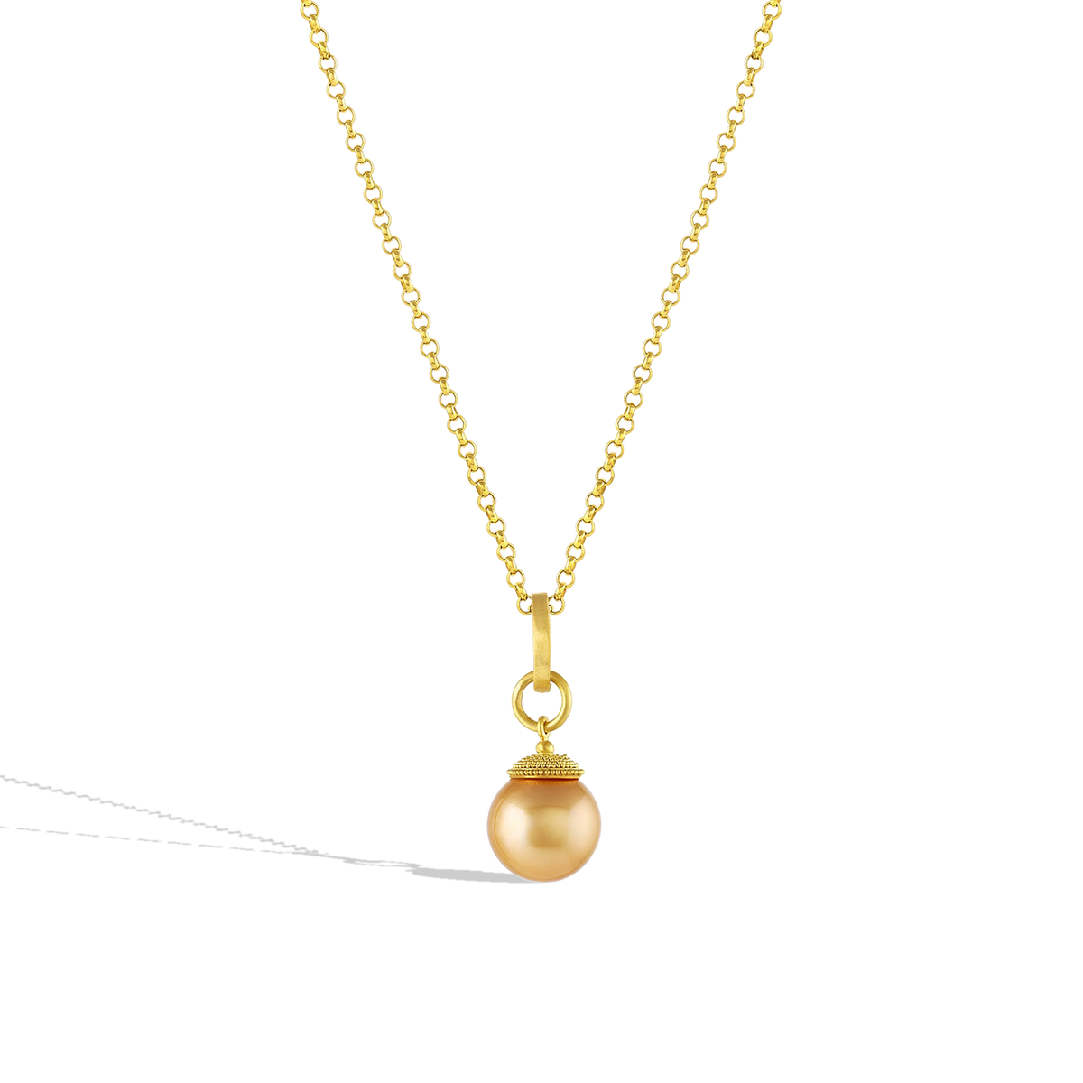 The Gold Pearl charm shown on a gold chain.