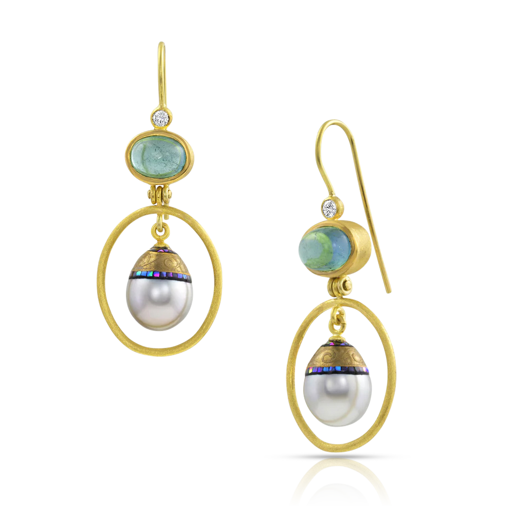 Silvery white Maki-e pearls swing from sea green cabochon tourmalines. Sparkling diamonds give light and coolness to the white in the pearls. The gold has been given a soft, parchment-like texture making it feel almost velvety to the touch. 18K gold ear wires. One-of-a-kind. Length approximately 45mm W 18mm (L 1.7in W .7in).  Made using recycled 18k & 22k yellow gold, Brazilian tourmalines (3.52ctw), Canadian diamonds (VS, F-G .11ctw) and cultured 9 x 12mm Maki-e Tahitian pearls. Website exclusive.
