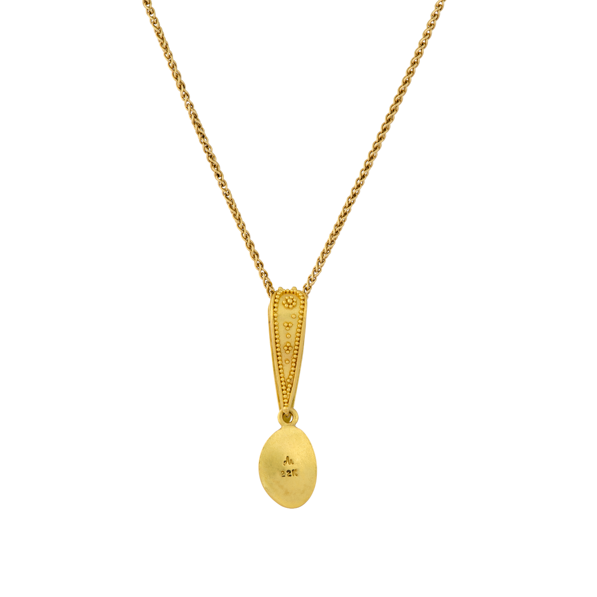 Back view of Io charm showing decorative granulation detail.