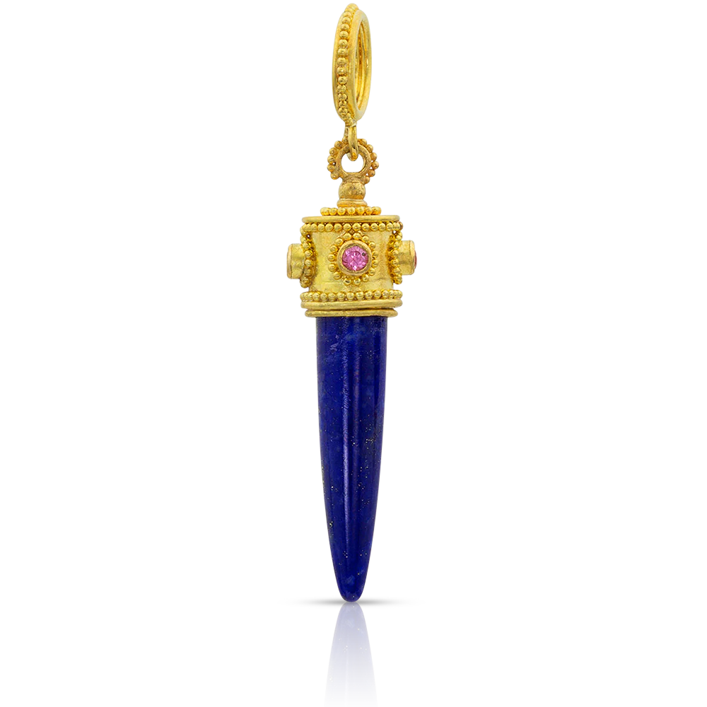 This lapis bullet style charm has a decorative granulated and pink spinel studded cap. A granulated bail completes it. The lapis is smooth to the touch and this is a very tactile charm.

Handmade using 22k gold and pink spinel (.16ctw). Length approximately 42mm, W 10mm (L 1.65in W 0.39in).

Slide on to our leather wrap, mix and match to create your own story. (Lilac leather wrap and additional charms sold separately.) Wear with your favorite bangles, vintage finds and treasured heirloom pieces. 