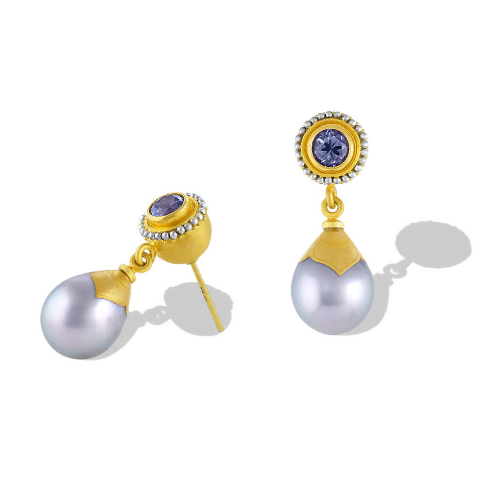Hollow golden spheres edged with a ruff of platinum and gold granulation, set with lavender spinel are the perfect foil for silvery gray Tahitian Maki-e pearls. Length approximately 25.5mm W 9.6mm (L 1in W .4in).

Made in recycled 22k yellow gold and platinum, lavender spinel (.88ctw) and Tahitian maki-e pearls (9.6 x 12.2mm).

One-of-a-kind.