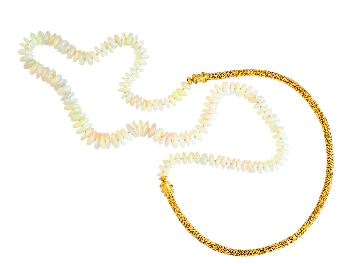 Length 32 inches.

Made with recycled 22k &amp; 18k yellow, Ethiopian Welo opal (175ctw) and Burmese spinel (.15ctw). Knotted on custom dyed silk.