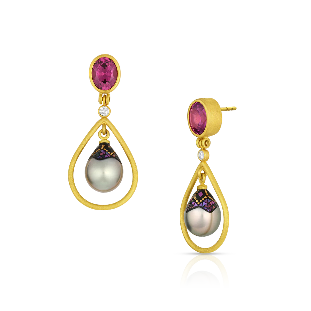 One-of-a-kind 22k yellow gold earrings featuring Maki-e pearls, Tanzanian Moyo Gems rhodolite garnets and Canadian diamonds. A texture has been applied to give a soft, parchment like feel to the gold. Length approximately 45 mm W 18mm (L 1.8in W .7in).

Made from recycled gold, Moyo rhodolite garnet (2.77ctw), Canadian diamonds (VS, F-G .11ctw) and 9 x 12mm Tahitian Maki-e pearls.