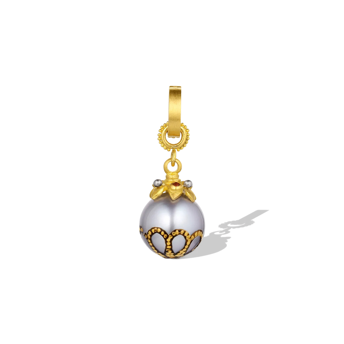 A dainty Maki-e pearl with a miniature bejeweled star cap. Deep red Anthill garnets complement the decorative 24 karat pattern painted on the lower half of the pearl, whilst the matte platinum granulation mirrors the soft silver tones in the pearl. A 20k gold clasp is included. L 28mm W 10.5 mm (L 1.1in W .41in).

Made from recycled 22k yellow gold, Fairtrade garnets from Arizona (.05ct) and a 10.1mm cultured Tahitian pearl. Please note that the chain is available separately.