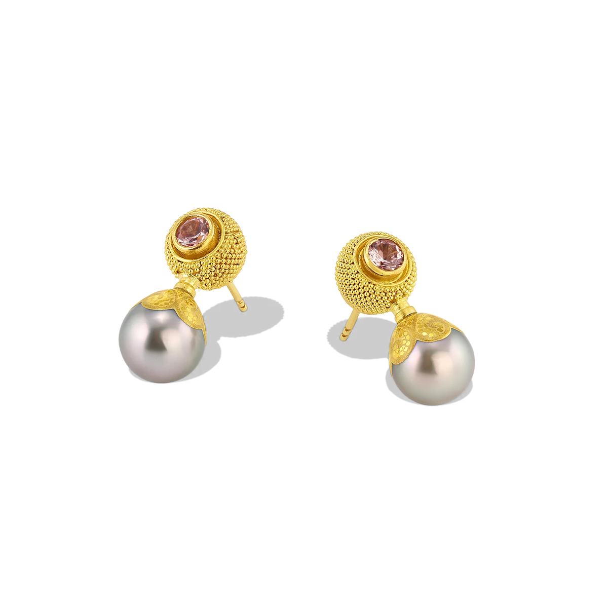 Soft silver Maki-e pearls with green undertones are topped with cushion-like granulated gold spheres set with soft Malaia garnets. While ancient in technique, granulation gives both an antique and very modern look. The soft pinkish orange garnet sparkle makes it a perfect choice for everyday wear. Length approximately 21mm W 9mm (L .8in W .4).

Made from recycled gold, Malaia garnet (.61ctw) and Tahitian Maki-e pearls.

One-of-a-kind.Additional view of the Malaia Garnet Velvet Cushion Drops.