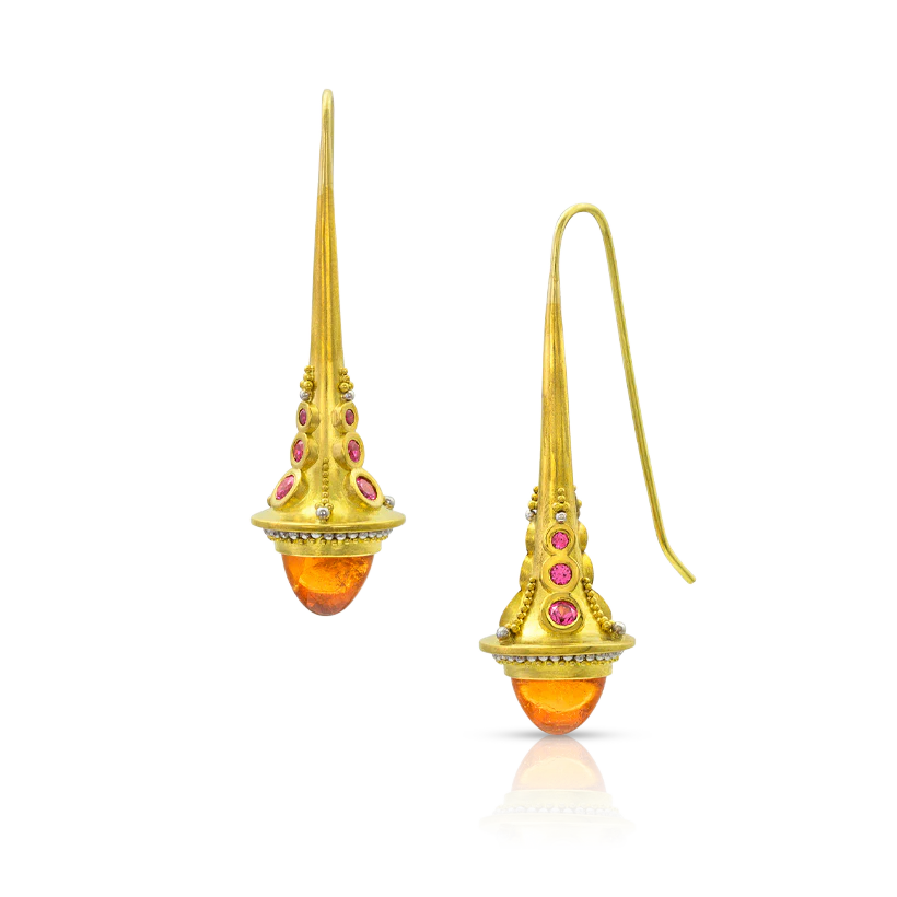 Rich, bright orange mandarin garnet cabochons are set lantern-like at the base of elegant, flared cones, surrounded by rows of granulation in gold and polished platinum. Hot pink spinel nestled between columns of graduated granulation sweep the gaze upwards to the French wires, making these earrings seem to almost invisibly drop from the ear.

Made from recycled 18 & 22k gold and platinum, mandarin garnet (8.82ct) and Burmese spinel (.88ct). 18k French ear wires. Length approximately 44 mm or 1.73 in.