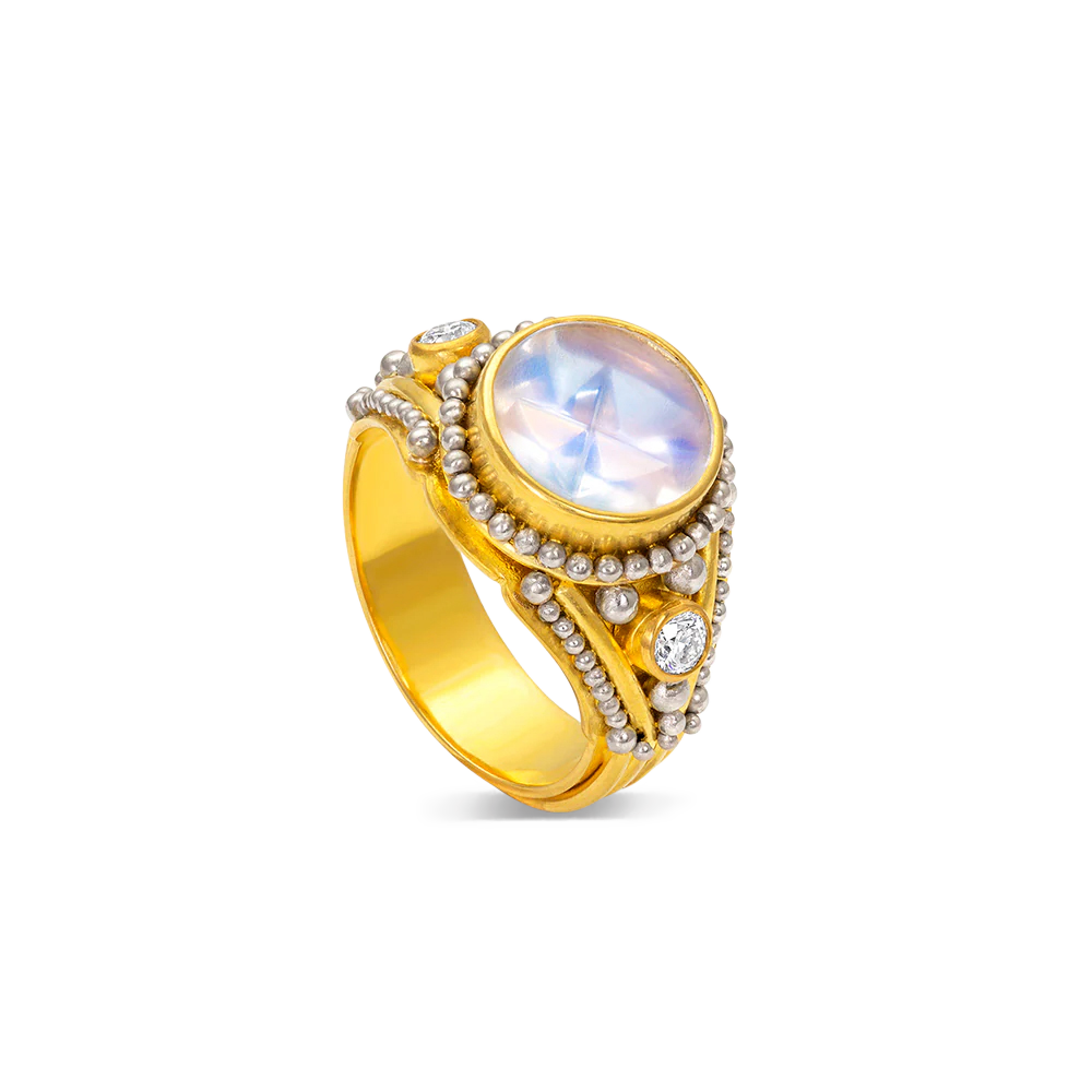 This ring truly brings together the ancient and modern worlds. This moonstone was cut in the atelier of Tom Munsteiner, renowned in the world of gem cutting. Here it is perfectly at home with the ancient art of granulation (although the granules in this ring are platinum, the ancients used gold) and classic brilliant cut accent diamonds.

Handmade using recycled 22k gold and platinum, Munsteiner moonstone (2.23ct) and Canadian diamonds VS, H (0.22ct). Size 6.5.