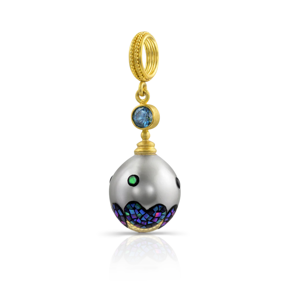 Maki-e is a traditional Japanese painting technique developed over a millennia ago where lacquer is applied to surfaces and a pure gold or silver paint is mixed in for a flat or a raised ornamentation. Decorative mosaics are created from tiny abalone shell tiles, often accented with the same gold or silver paint. Many of the designs on the pearls are unique, giving a truly one-of-a-kind charm. 
Chain is available separatey.