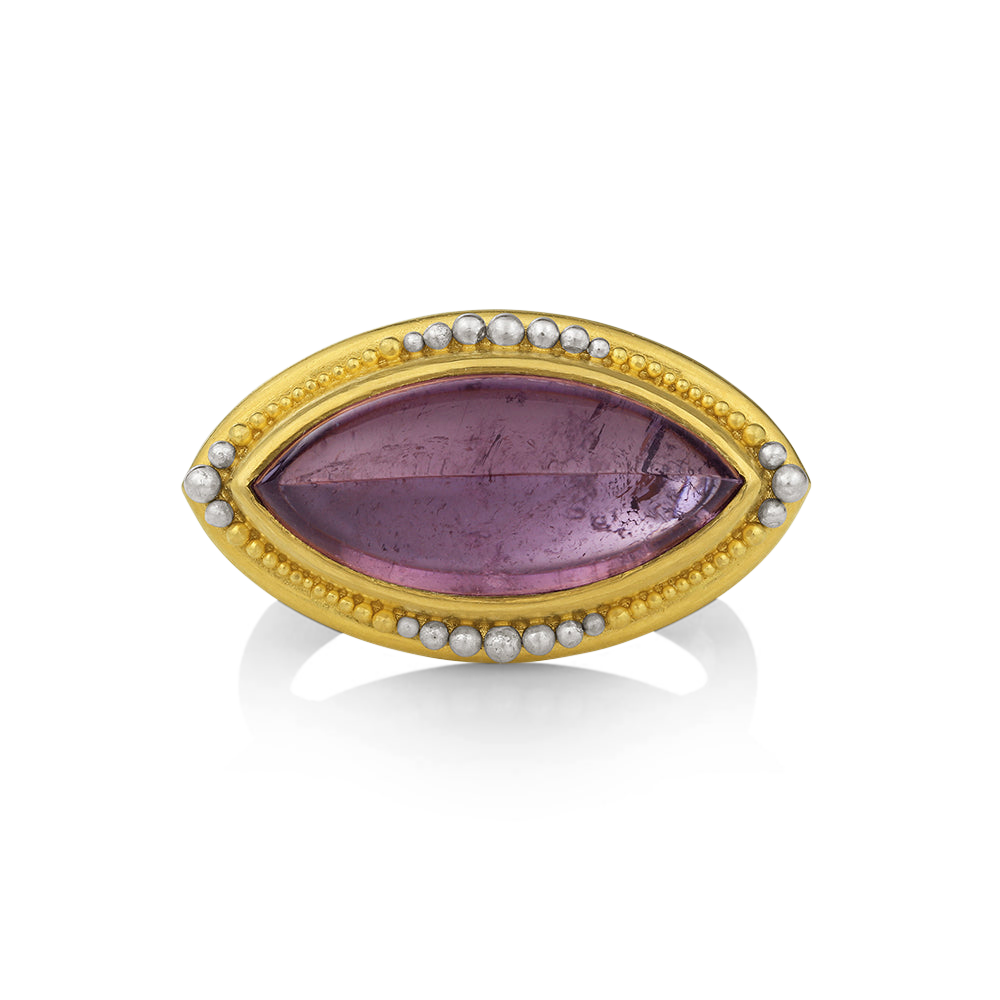 A rich, deep, purple navette shape tourmaline is surrounded by our signature graduated gold and platinum granulation.

Made in recycled 22k yellow gold and platinum and a Nigerian tourmaline (9.35ctw). Size 8. Can be resized. One-of-a-kind.