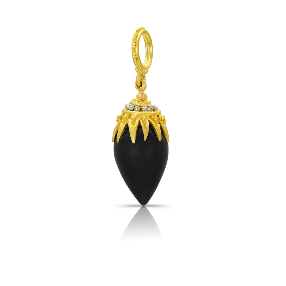 This beautiful charm is a sister to its rock crystal counterpart and is made from a matte black onyx drop enhanced with our intricately granulated signature "spider" cap, featuring both gold and platinum granulation. Wear amulet style on a leather cord by itself or on a favorite chain, nestled amongst your other charms and necklaces. W 10.8 X L 33 mm (W .43 X L 1.3 in). Also available in black Tahitian pearl.

Handmade in recycled 22k gold and platinum and black onyx (9.76ctw).