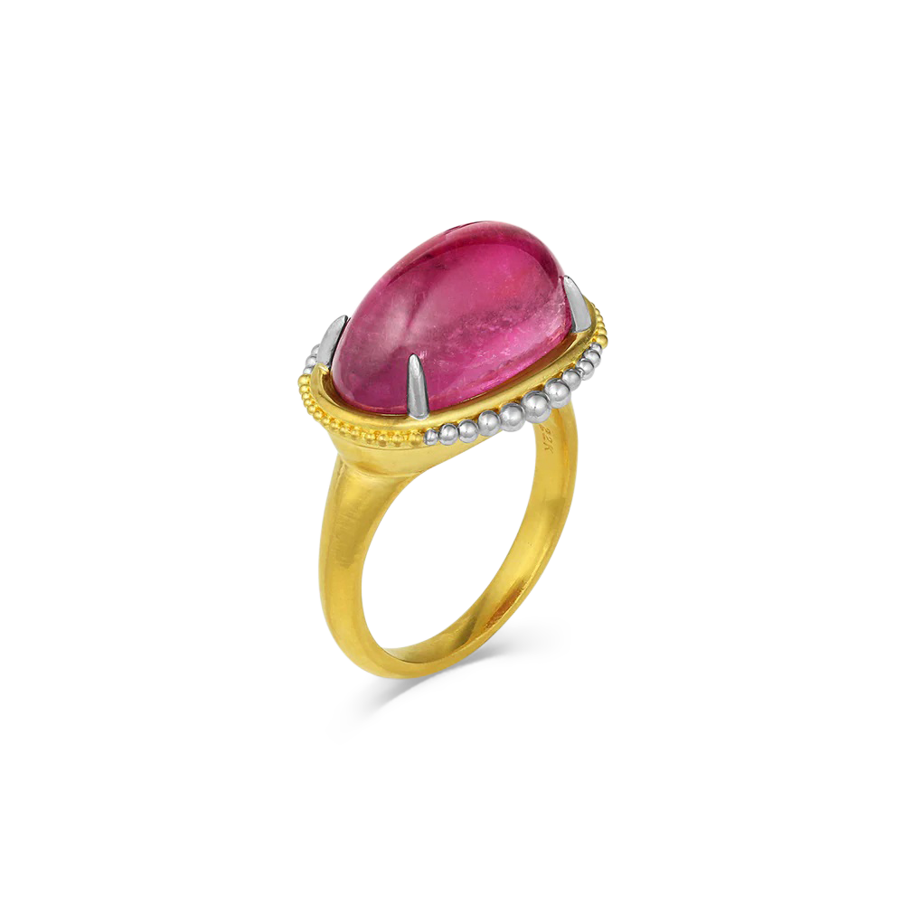 This was a stone that as soon as I saw it, I had to have it - even though I had absolutely no idea what I was going to make with it. The rich, raspberry pink tourmaline (11.79ct) and unusual cabochon lozenge shape spoke to me, and it came from Mozambique in Africa - my favorite continent for gemstones. Graduated platinum and gold granulation give a truly unique ring. One-of-a-kind.

Made in recycled 22k yellow gold and platinum and a Mozambican tourmaline. Size 7.