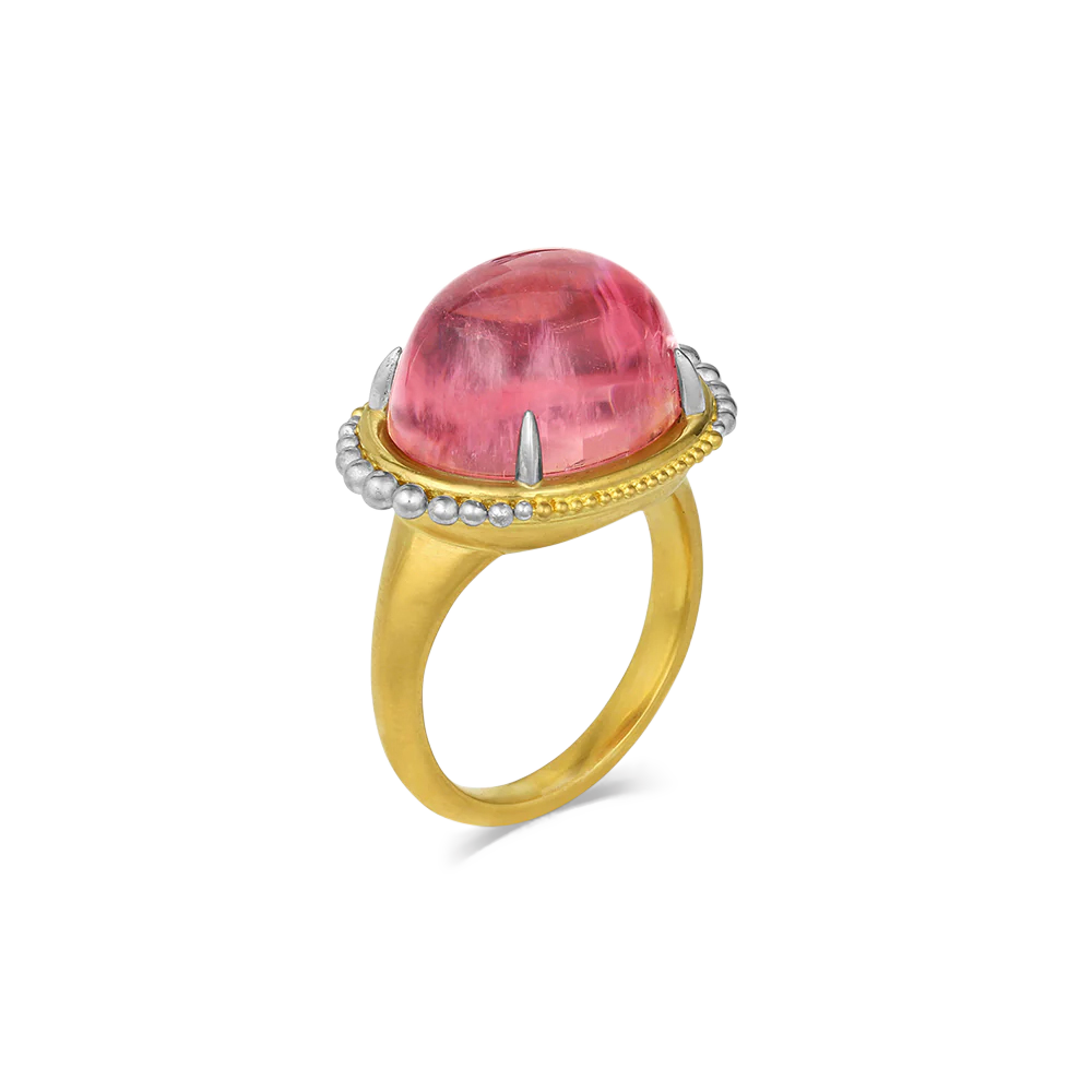 This beautiful salmon pink tourmaline (15.13ct) edged with our signature graduated gold and polished platinum granulation floating orbit-like around it, is like wearing your favorite bejeweled jelly candy, but on your hand! One-of-a-kind.

Made in recycled 22k yellow gold and platinum and a Mozambiquan tourmaline. Size 7.