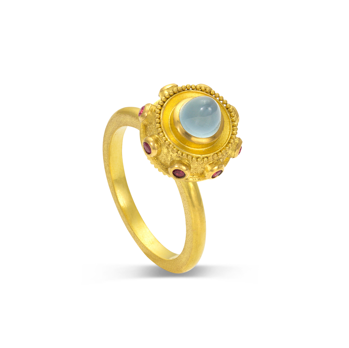 This dainty ring is reminiscent of a bejeweled Orb. Instead of a customary cross mounted top it, this one has a milky aquamarine (0.84ct) cut in a "bullet" style cabochon with a band of glittering hot pink spinels (.15ct) and golden balls of granulation surrounding it.

Made in recycled 22k yellow gold, responsibly sourced aquamarine (.84ctw) and spinel (.15ctw). Size 6.5. Can be resized. Made to order.