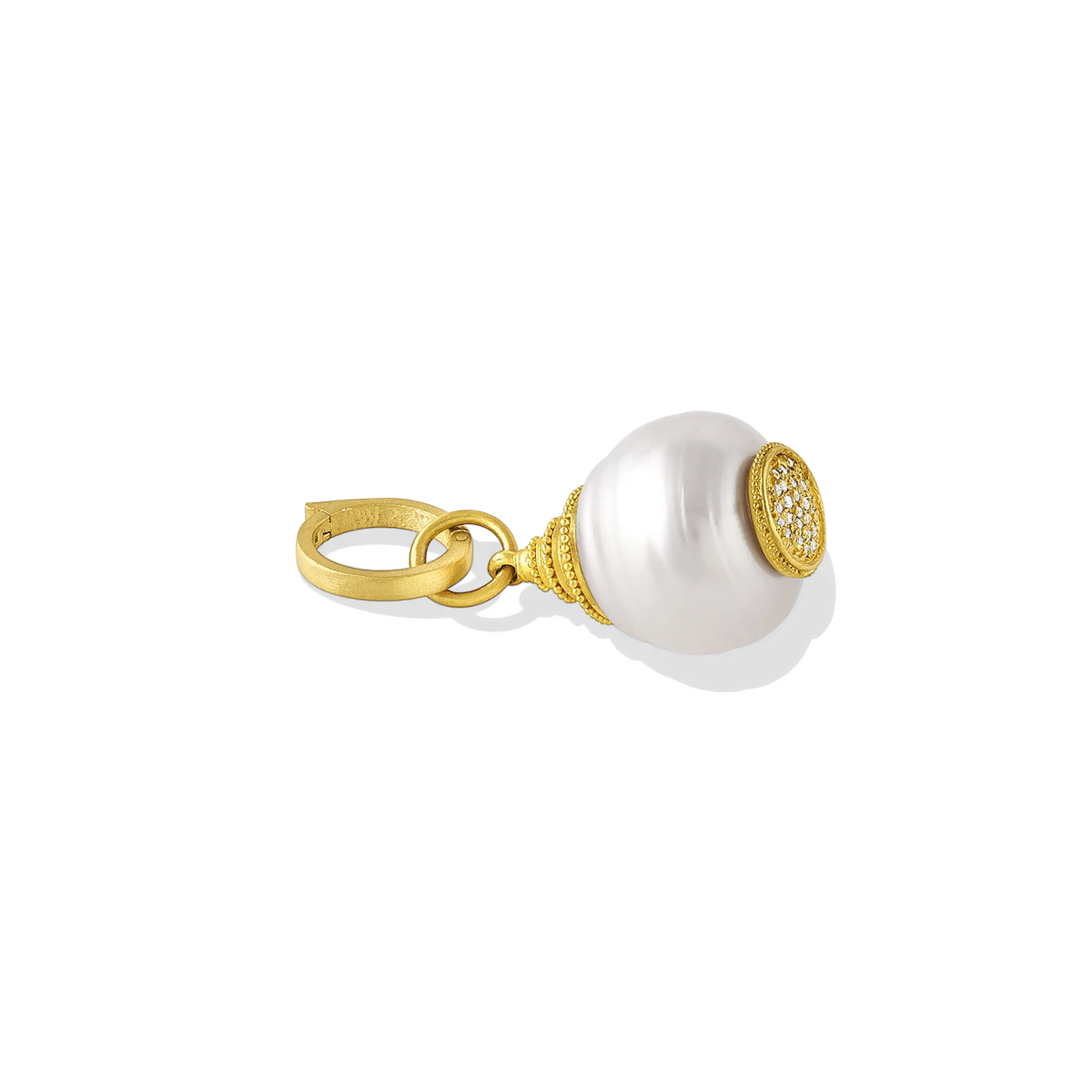 An unusual pagoda shaped white circlé South Sea Pearl is adorned top and bottom with the soft buttery tones of golden granulation and a pavé diamond sparkle. Wearing this pearl is fun, the pagoda shape makes it both casual and occasion wear and it's great layered with other favorite charms.&nbsp;A 20k gold clasp is included. Length approximately 39mm, width 16mm (L 1.5in W .6in).

Made from recycled 22k and 20k gold, responsibly sourced diamonds and a 16mm Paspaley South Sea pearl.