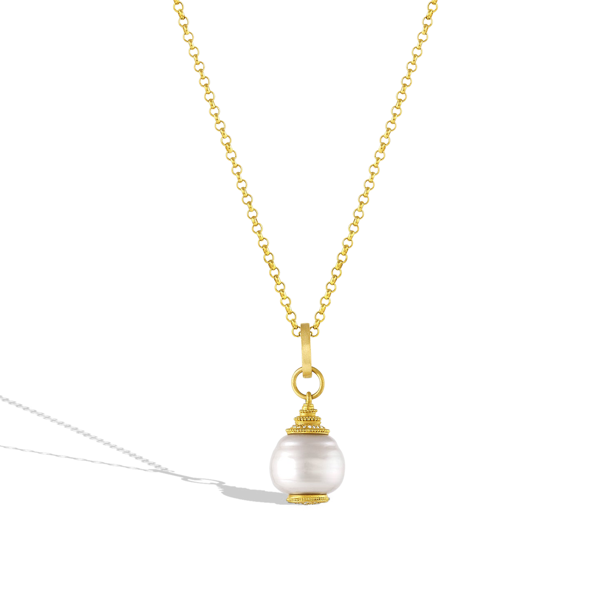 The Pagoda pearl shown on a gold chain.