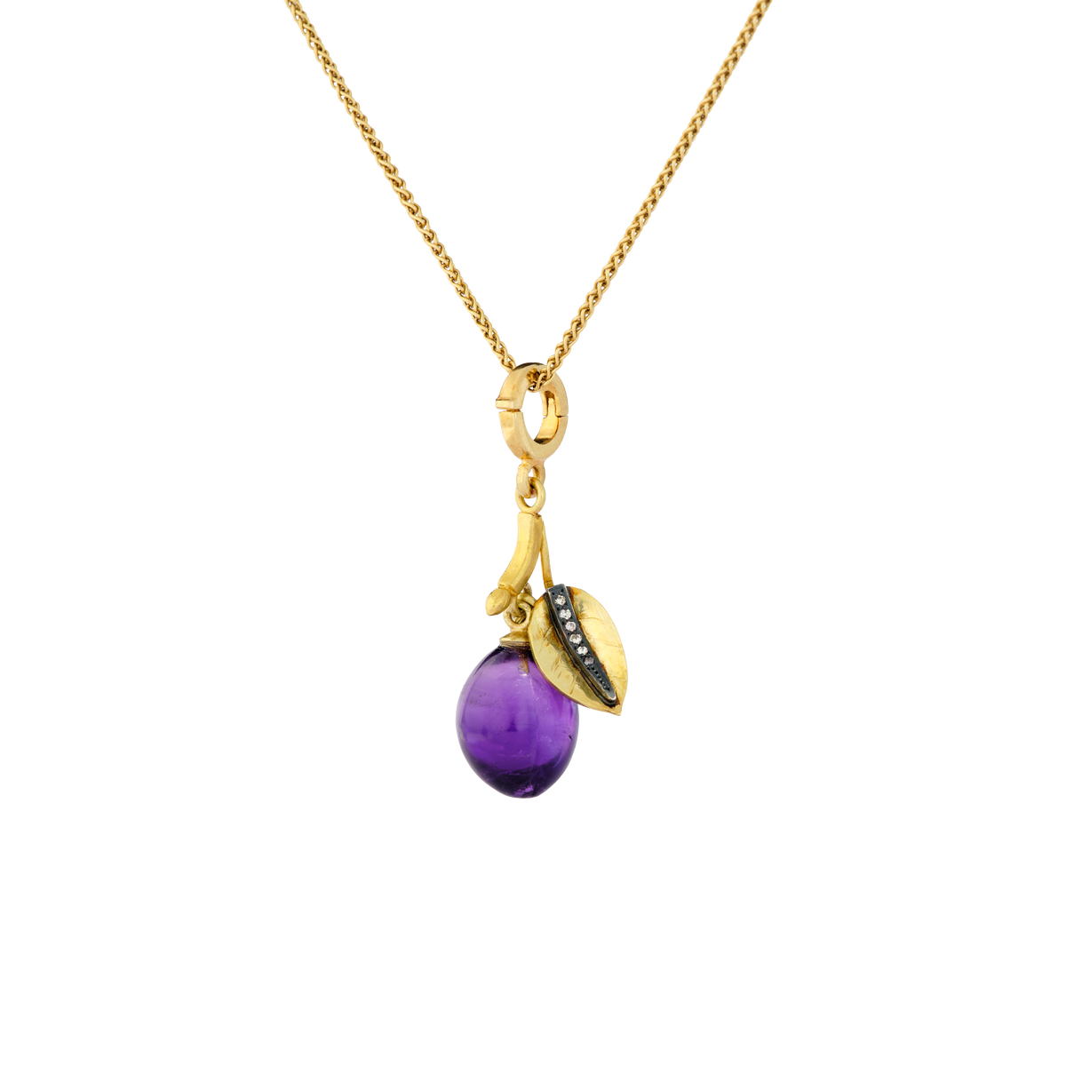 This exquisitely hand carved amethyst plum has a moveable diamond veined leaf and bud and green tsavorite garnet (representing growth and renewal). An opening/closing clasp is included. Length approximately 36.5mm, width 12mm (L 1.4in W .45n)

Made from recycled 22k gold, a hand carved amethyst plum (9.33ctw), diamonds (.10ctw) and tsavorite garnet (.12ctw). The chain is available separately.

One-of-a-kind.