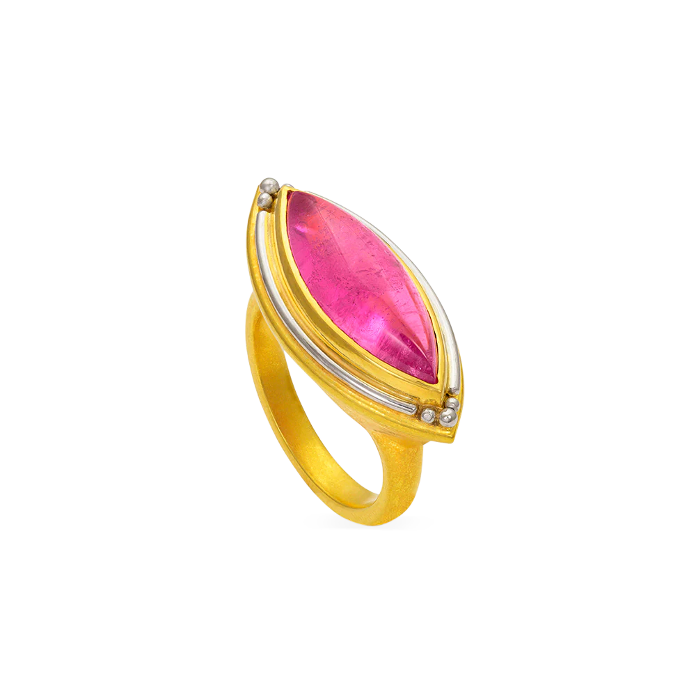 One-of-a-kind ring featuring a deep pink marquise shape cabochon tourmaline highlighted by polished platinum. This is the larger of the two rings in this style and the east west measurement is 27mm. Made in 22k yellow gold and platinum and a Nigerian tourmaline(5.83ct). Size 7. Can be resized.