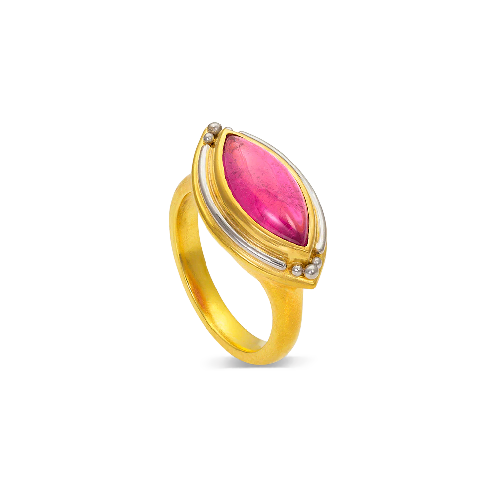This is the second and smaller of two rings in this style, featuring a deep pink marquise shape cabochon tourmaline surrounded by polished platinum. The east west measurement is 21mm.

Made in 22k yellow gold and platinum and a Nigerian tourmaline (2.99ctw). Size 6.5. Can be resized. One-of-two-of-a-kind.