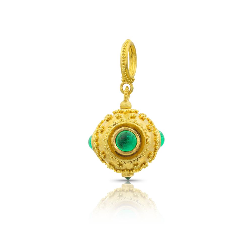 Inspired by the Archeological Revival style jewelry of the 1800s and the beautiful Etruscan jewelry unearthed at Cervetari and other sites, this elaborately granulated charm features both cabochon and faceted emeralds.

Handmade using recycled 22k yellow gold and Colombian emeralds (1ctw). W 15 X L 27 mm (W .6 X L 1.1 in).

One-of-a-kind.