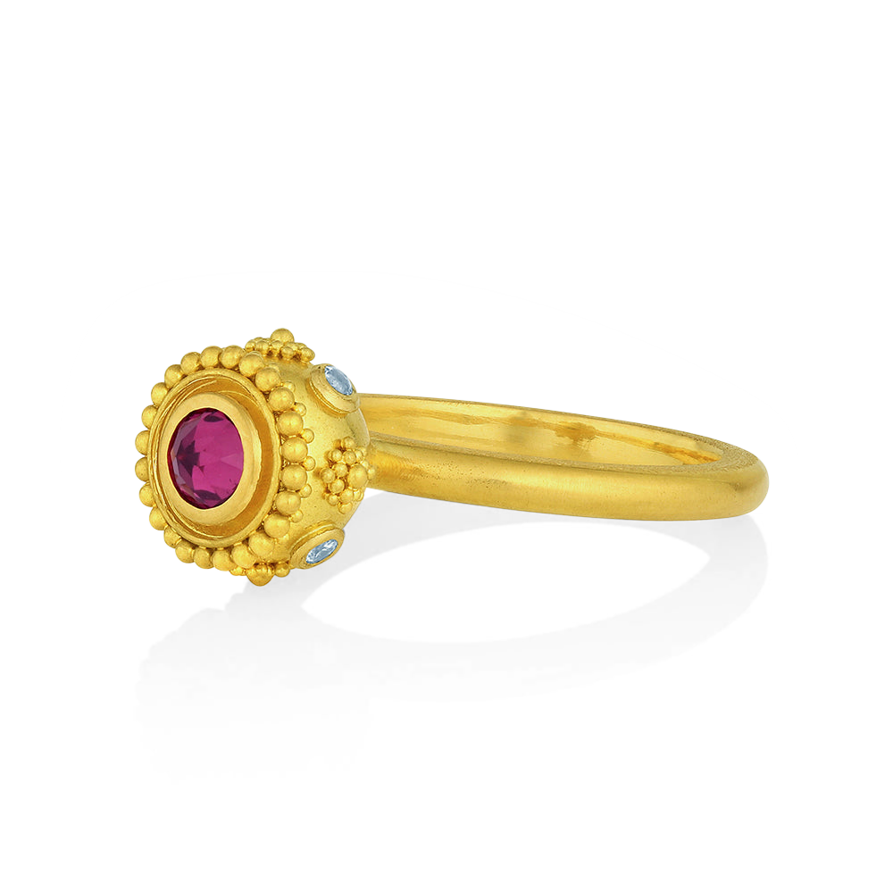 Angled front view of rhodolite garnet Sfaira ring.