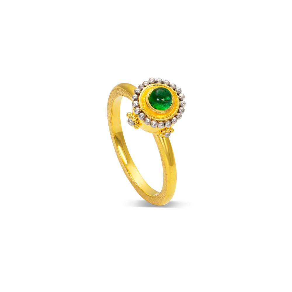A polished silvery platinum halo and soft gold granulation cradle this green Paraiba tourmaline cabochon. This bejeweled Sfaira sphere is a charming single ring or create your own story by mixing with other Orb rings or your favorite stacking bands.